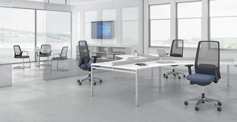 Ergonomic office setup with adjustable tables and chairs for comfort